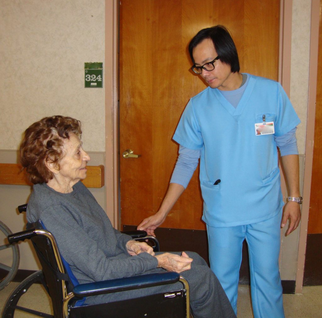 NURSE_PAUL_WITH_THERESA_ORIGINAL St. Patrick’s Home provides 24-hour nursing care under the direction of a Medical Director, Primary Care Physicians, Director of Nursing, Licensed Nurses and Certified Geriatric Nursing Assistants.